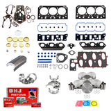 A variety of engine components and gaskets, including head gaskets, pistons, piston rings, bearings, and seals, are neatly arranged. At the bottom left, there is a red DNJ Pistons box with multiple parts next to it—perfect for your Partsology Engine Rebuild Kit for a Chevrolet Camaro or Pontiac Firebird.