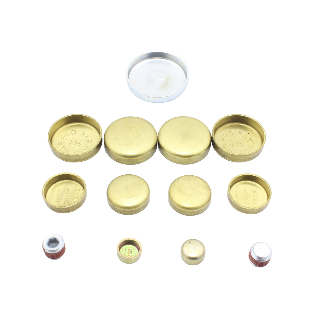 A collection of brass and metallic plugs and caps, organized in rows on a white background. The Engine Rebuild Kit by Partsology features an assortment of various sizes and shapes, with some pieces engraved with measurements like "1 1/4".